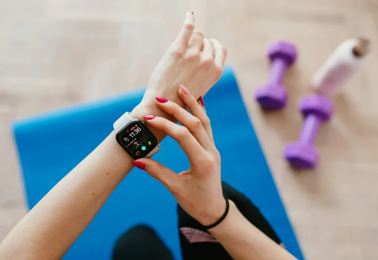 Tracking wellness with smartwatch—blending physical fitness and digital tech.
