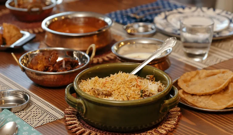 various food on table, placed in containers, plates are arranged