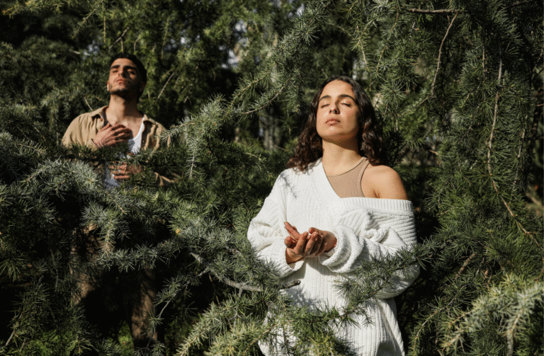 Two people pausing mindfully in nature, embodying rest and reflection balance.