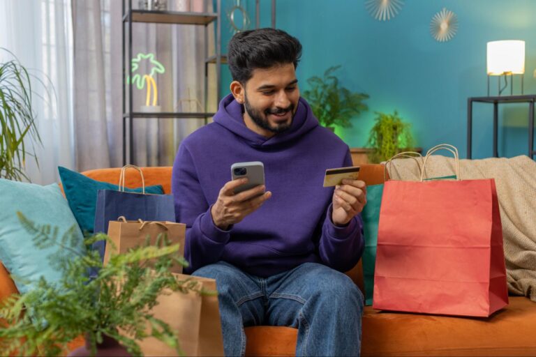 Young shopper making an online payment using a BNPL app on mobile.