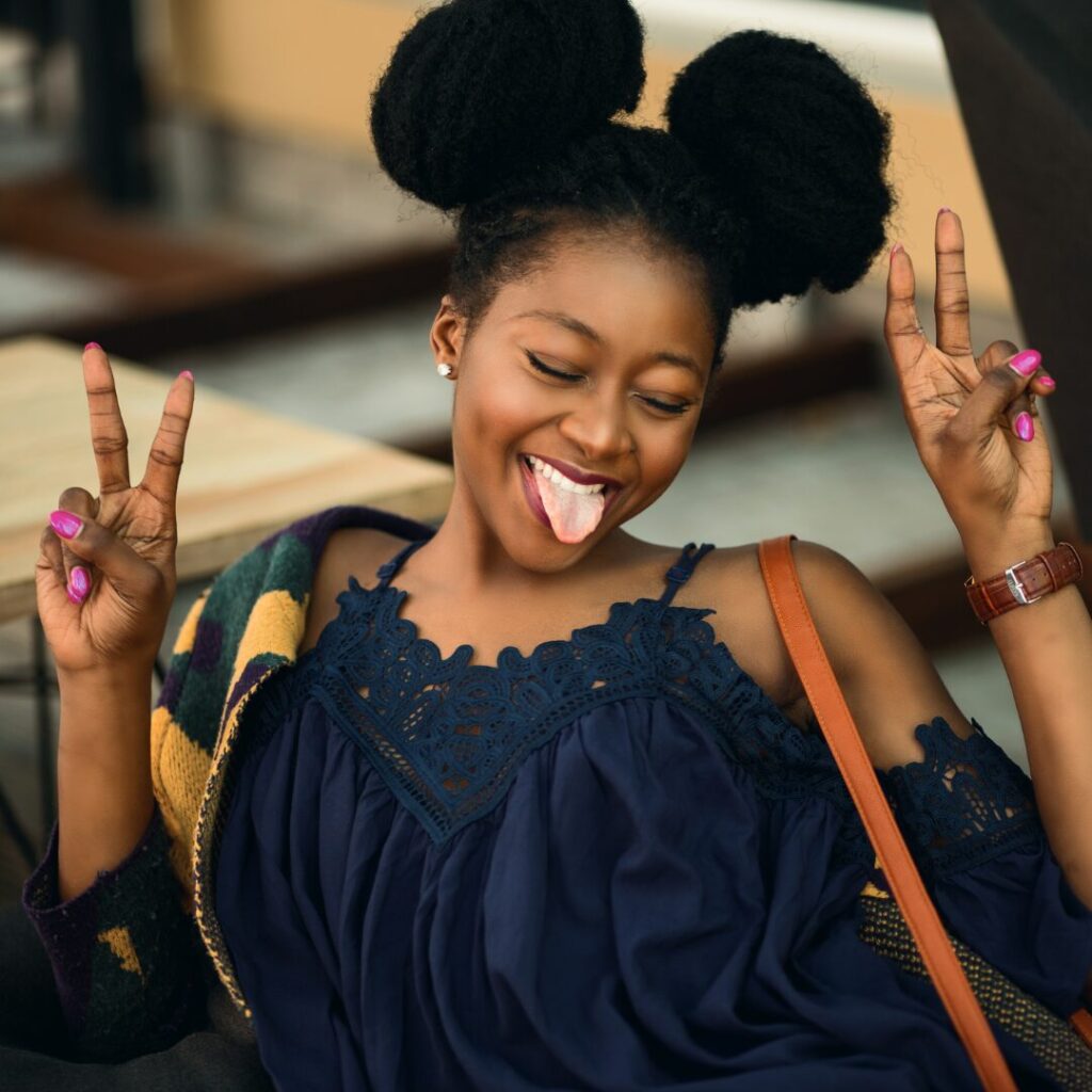 Fun loving woman with peace sign.